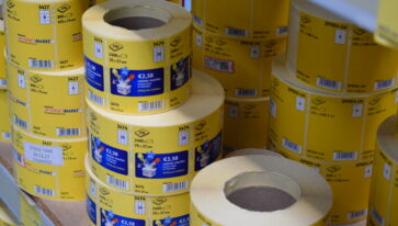 Label manufacture adhesive matrix removal systems