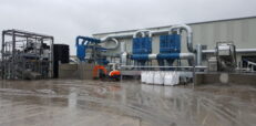 Dust control system at material processing plant