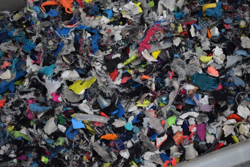 Textile material recovery and recycling